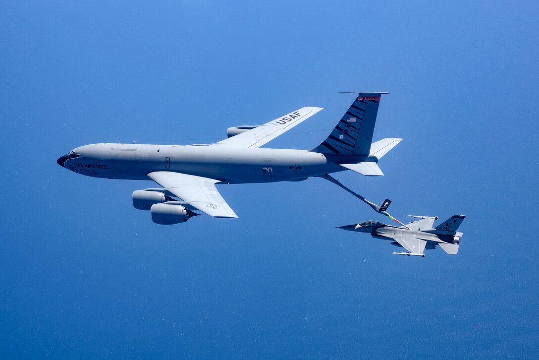 A picture of a KC-135 Stratotanker military refueling aircraft from the 108th Wing refueling a 177th Fighter Wing F-16C Fighting Falcon.