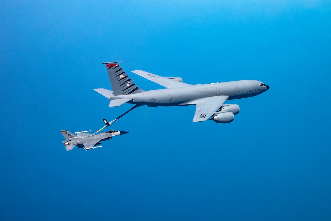 A picture of a KC-135 Stratotanker military refueling aircraft from the 108th Wing refueling a 177th Fighter Wing F-16C Fighting Falcon.