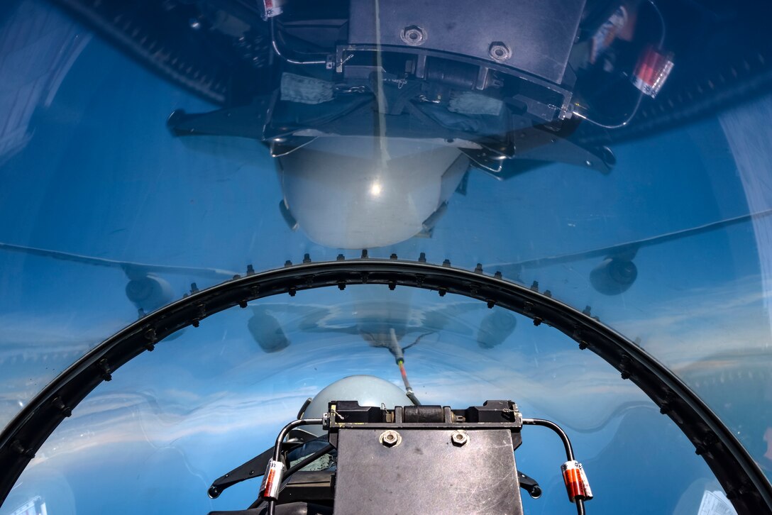 A picture of a KC-135 Stratotanker military refueling aircraft from the 108th Wing refueling a 177th Fighter Wing F-16D Fighting Falcon.