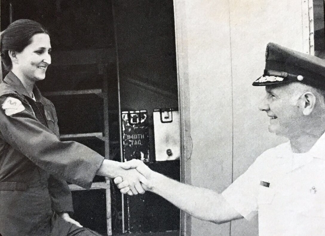 Staff Sgt. Wanda Busby recently added her mark in the annals of Woman Power as she became the first female Weather Observer in the Air Force Reserve. She is assigned to teh 920th Weather Reconnaissance Group, Keesler Air Force Base, Mississippi, and is being congratulated by Maj. Gen. Sidney Novaresi, commander of the 4th Air Force Reserve.  (Courtesy photo) (Image cropped and cutline information from news article dated November 11, 1977)