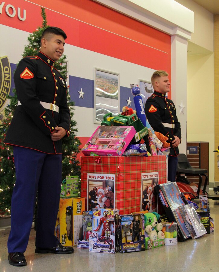CAMP HUMPHREYS, South Korea -- Marines with U.S. Marine Corps Forces Korea volunteer at a Toys for Tots stand here on Dec. 1.  The Marines’ Toys for Tots program is an annual campaign held by U.S. Marine Corps Reserve around the holidays to help less fortunate children. The collected toys will be donated to local children’s hospitals and orphanages in Korea. (U.S. Marine Corps photos by Sgt. Parker R. Golz)