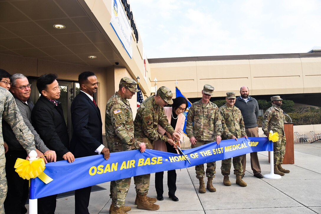 Col. Christopher Crary, U.S. Army Corps of Engineers (USACE), Far East District (FED) commander, along with other distinguished guests, participate in the 51st Medical Group Hospital expansion and renovation ribbon cutting ceremony, Osan Air Base, South Korea, Nov. 26. (Photos by Antwaun J. Parrish)