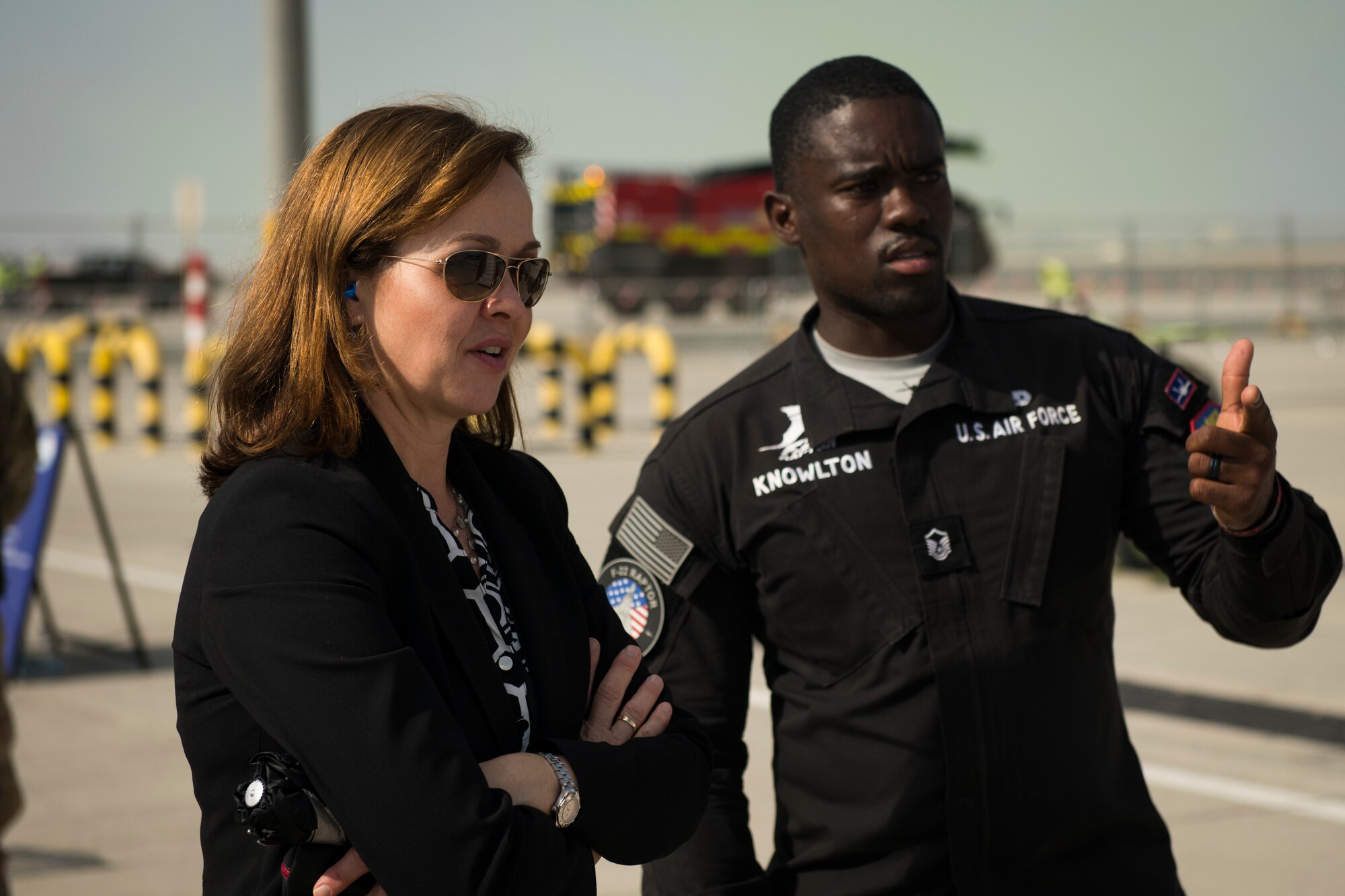 Kelli Seybolt, left, the Deputy Under Secretary of the Air Force, International Affairs, discusses F-22 Raptor capabilities with U.S. Air Force Master Sgt. Emanuel Knowlton, the F-22 Demonstration Team superintendent, at the Dubai Airshow, United Arab Emirates, on Nov. 18, 2019.