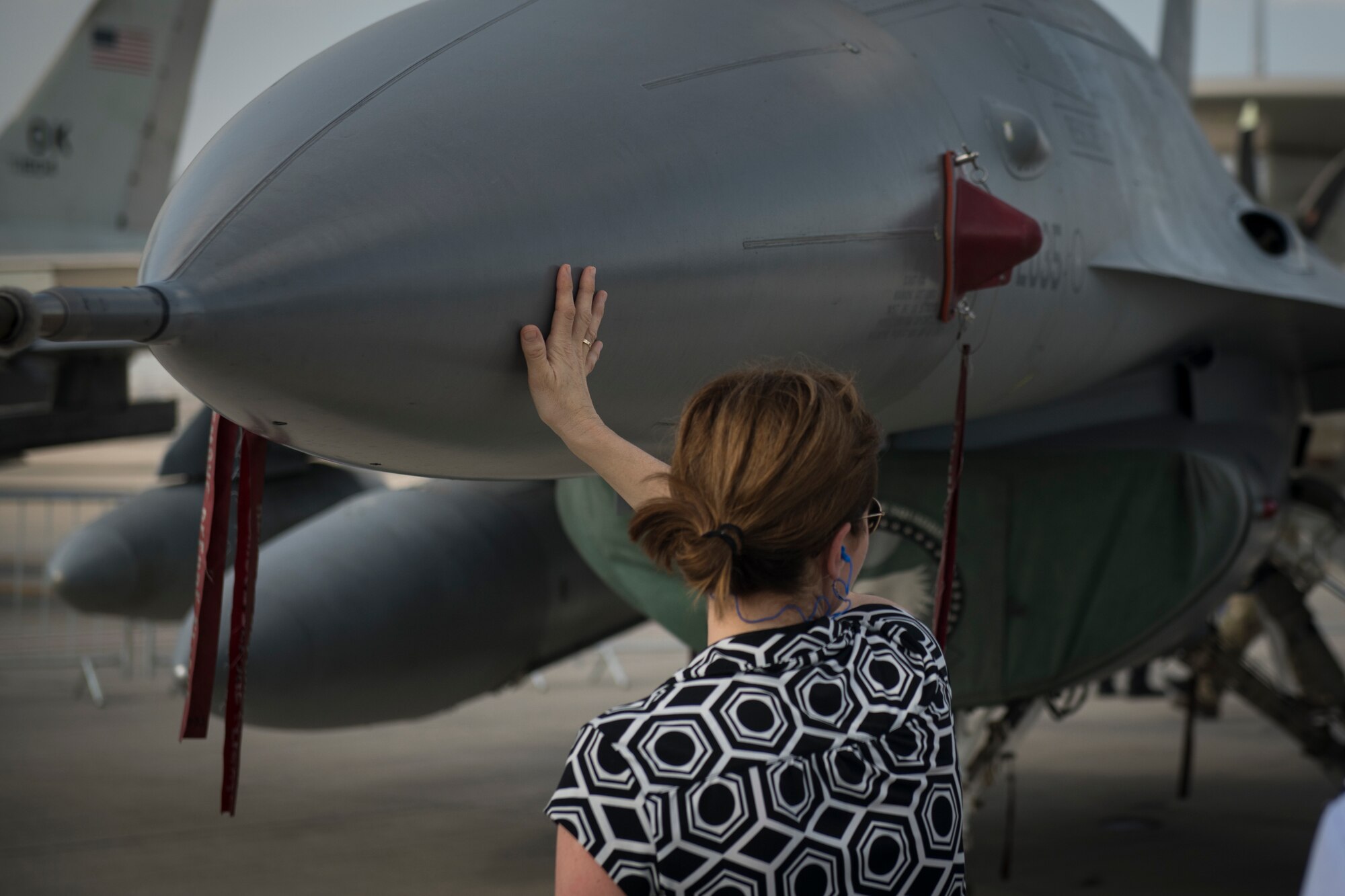 Kelli Seybolt, center, the Deputy Under Secretary of the Air Force, International Affairs, tours an F-16 Fighting Falcon alongside U.S. Air Force senior leaders at the Dubai Airshow, United Arab Emirates, on Nov. 18, 2019.