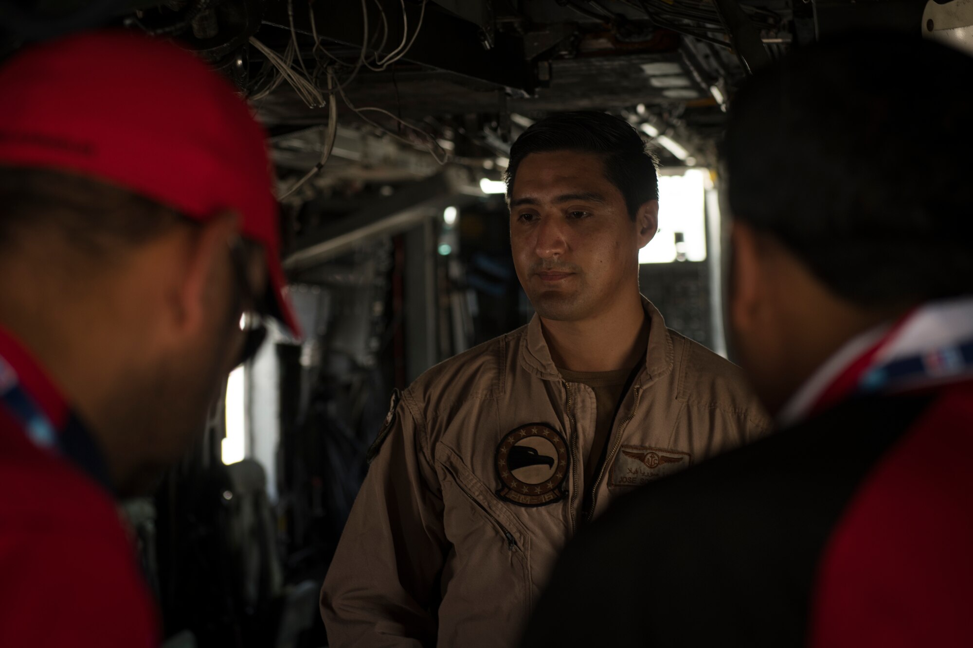 U.S. Navy AWS2 (NAC/AW) Jose Soria Avila, an MH-53E Sea Dragon crew chief with the Helicopter Mine Countermeasures Squadron 15 (HM-15), briefs the United Arab Emirates Special Olympics team at the Dubai Airshow, United Arab Emirates, Nov. 18, 2019.