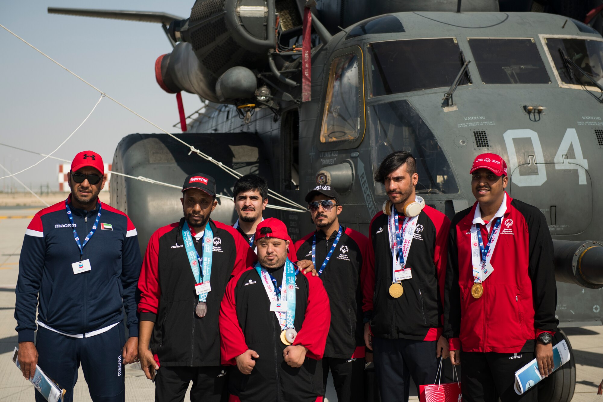 Members of the United Arab Emirates Special Olympics team tour U.S. military aircraft at the Dubai Airshow, United Arab Emirates, Nov. 18, 2019.