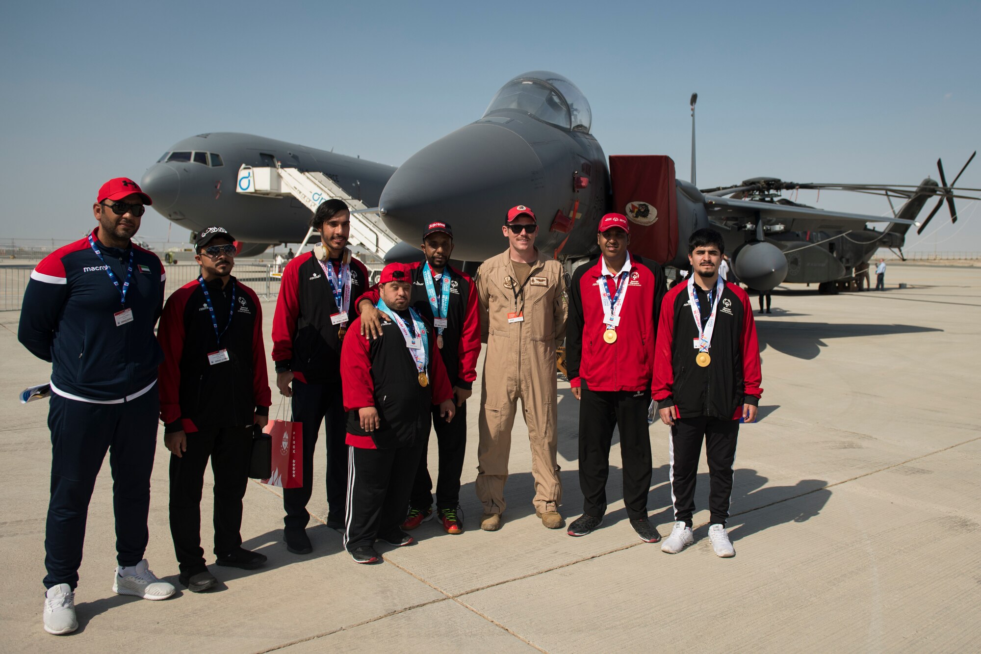 U.S. Air Force 1st Lt. Joshua Bezold, an F-15E Strike Eagle pilot with the 494th Fighter Squadron, briefs the United Arab Emirates Special Olympics team at the Dubai Airshow, United Arab Emirates, Nov. 18, 2019.