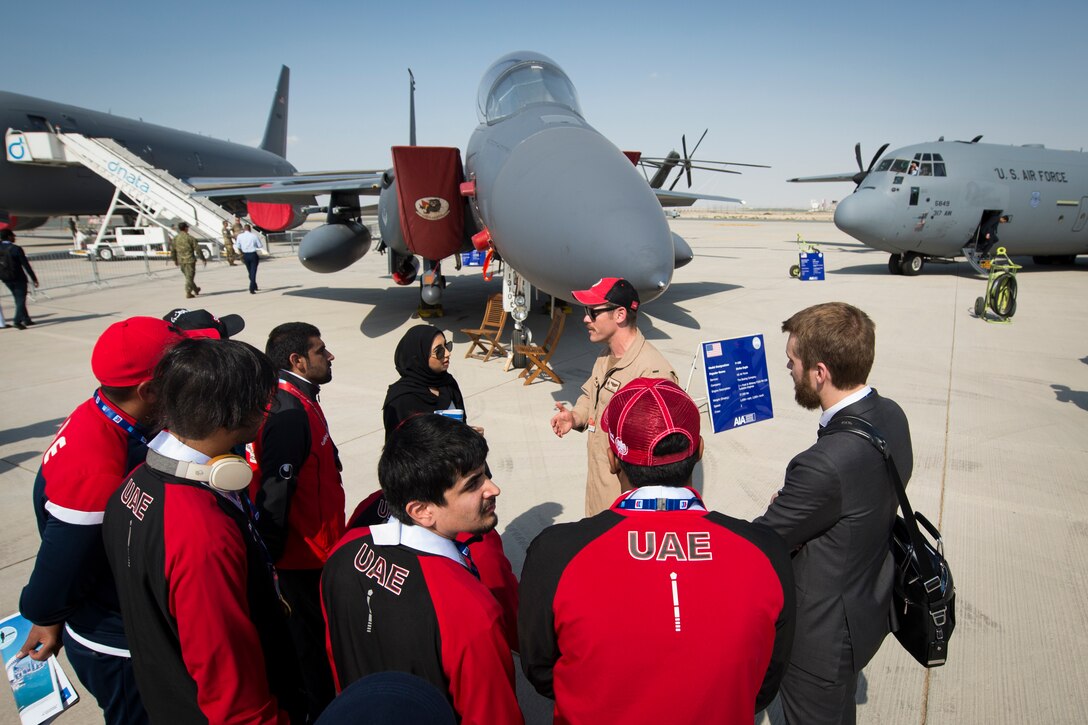 U.S. Air Force 1st Lt. Joshua Bezold, an F-15E Strike Eagle pilot with the 494th Fighter Squadron, briefs the United Arab Emirates Special Olympics team at the Dubai Airshow, United Arab Emirates, Nov. 18, 2019.