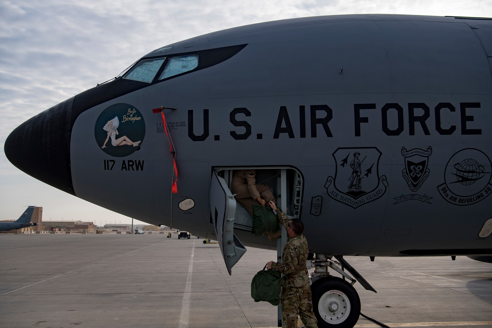 U.S. Air Force aircrew members load equipment into a U.S. Air Force KC-135 Stratotanker, at Al Udeid Air Base, Nov. 20, 2019.