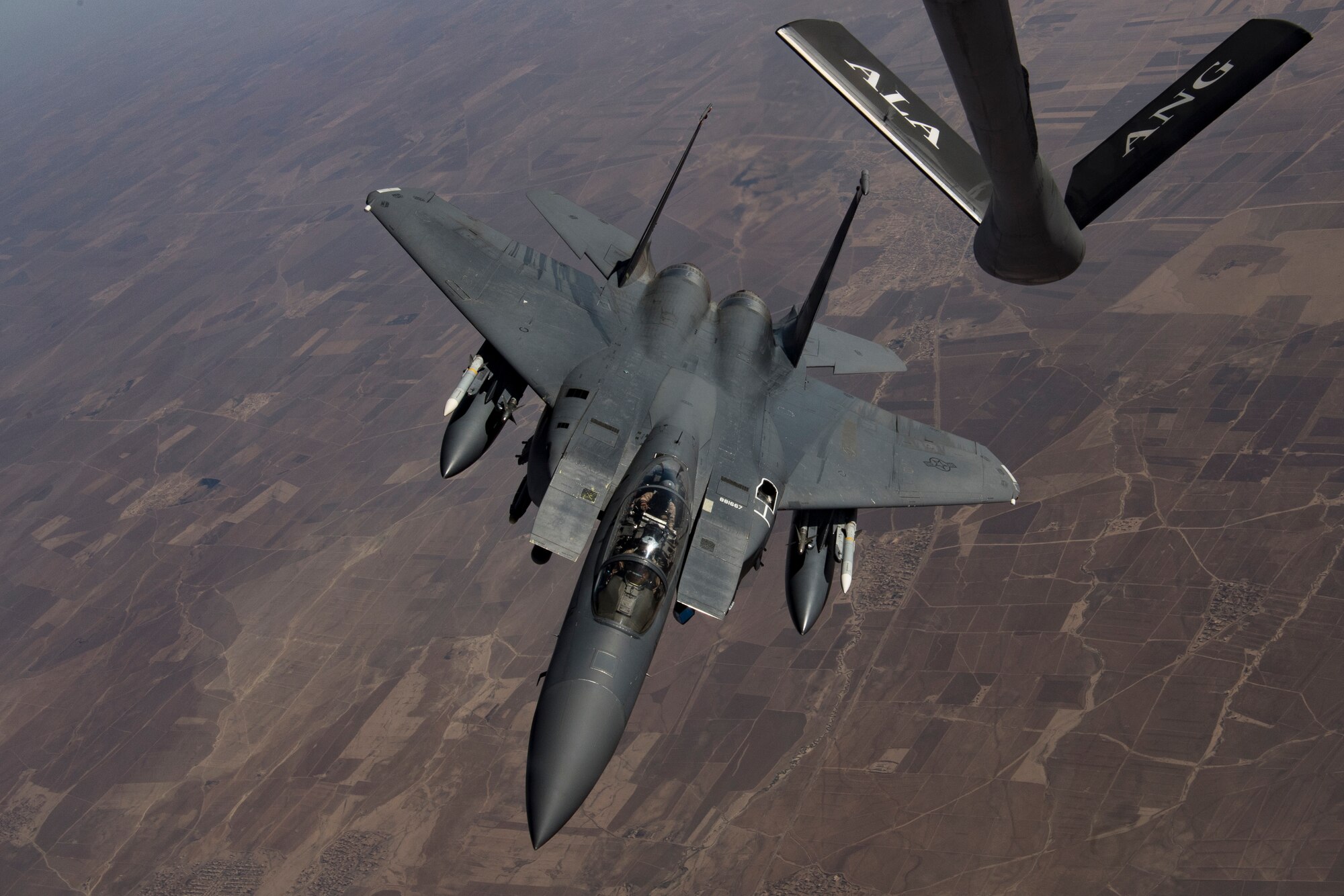 A U.S. Air Force F-15 Strike Eagle departs a U.S. Air Force KC-135 Stratotanker after conducting an aerial refueling over northern Iraq, Nov. 20, 2019.