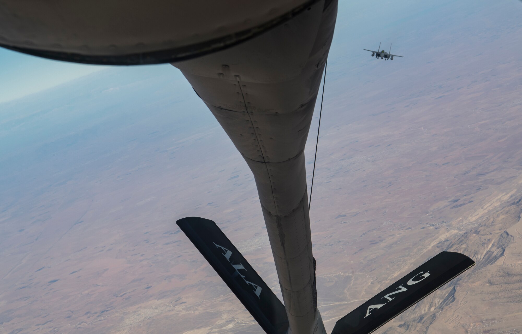 A U.S. Air Force KC-135 Stratotanker prepares to refuel an approaching U.S. Air Force F-15 Strike Eagle over northern Iraq, Nov. 20, 2019.