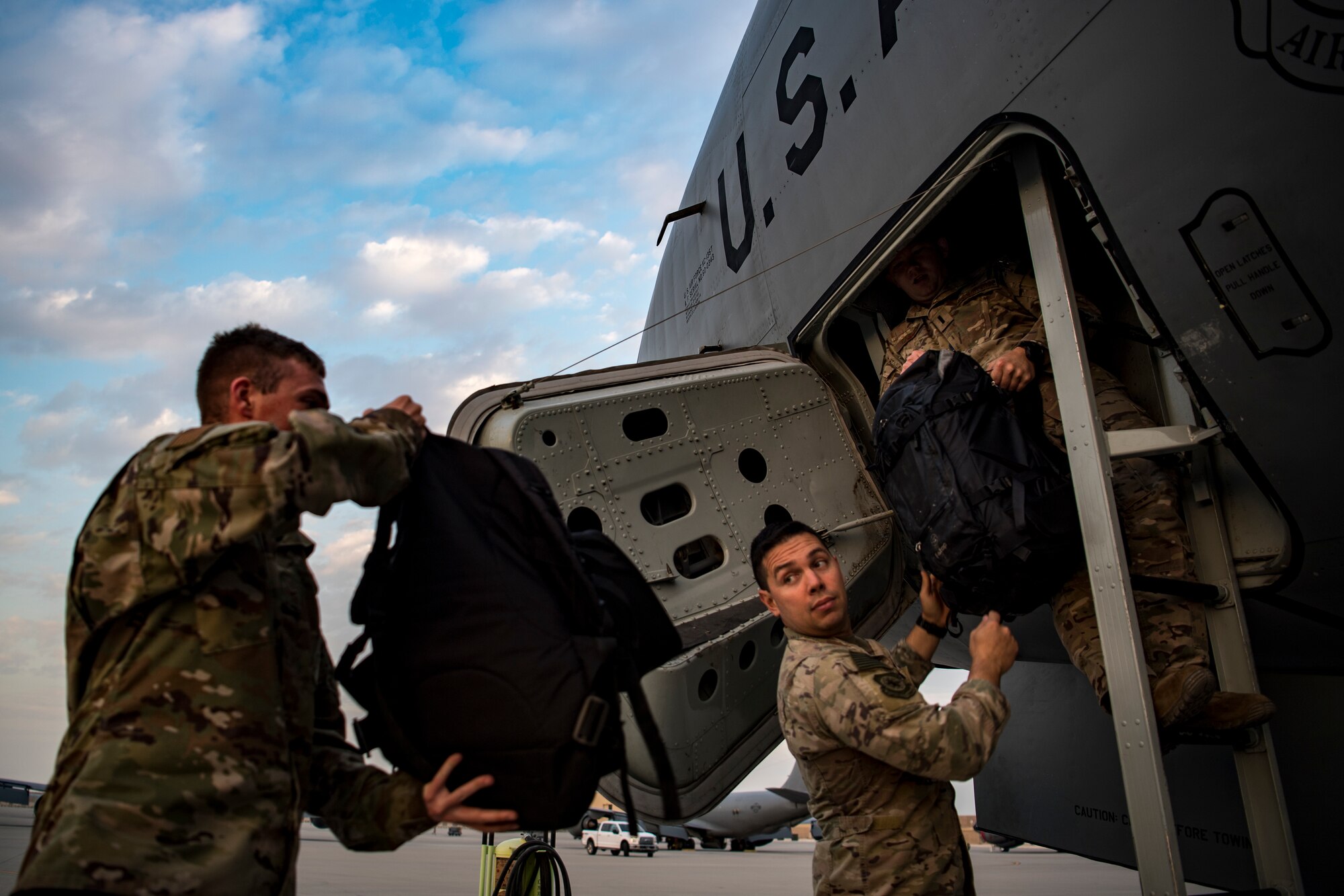 U.S. Air Force aircrew with the 28th Expeditionary Air Refueling Squadron load equipment into a U.S. Air Force KC-135 Stratotanker, at Al Udeid Air Base, Nov. 24, 2019.