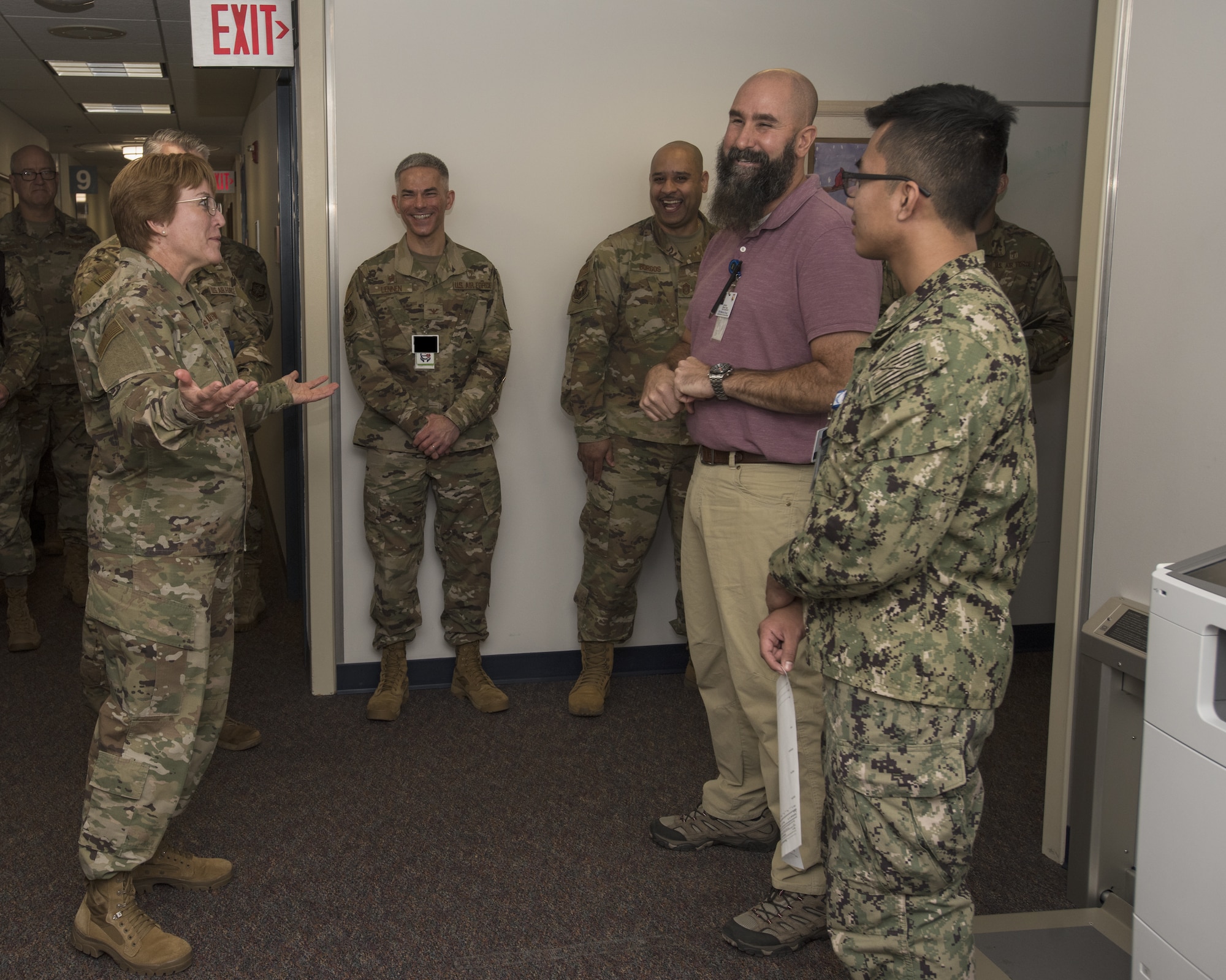 Lt. Gen. Dorothy Hogg, U.S. Air Force Surgeon General, laughs with members from the 87th Medical Group during a tour at Joint Base McGuire-Dix-Lakehurst, N.J., Nov. 21, 2019. Hogg toured different units within the MDG and learned of innovations and new systems the team has implemented to provide quality patient care. A new program the MDG is implementing is Sick Call; a system for Active Duty military members to receive immediate care on non-emergent illnesses in an effort to alleviate appointment loads and wait times for care. (U.S. Air Force illustration by Airman 1st Class Ariel Owings)