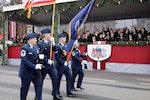 Members of the Michigan Air National Guard pass the official viewing party during the Latvian Independence Day military parade through Riga, Latvia, Nov. 18, 2019.
