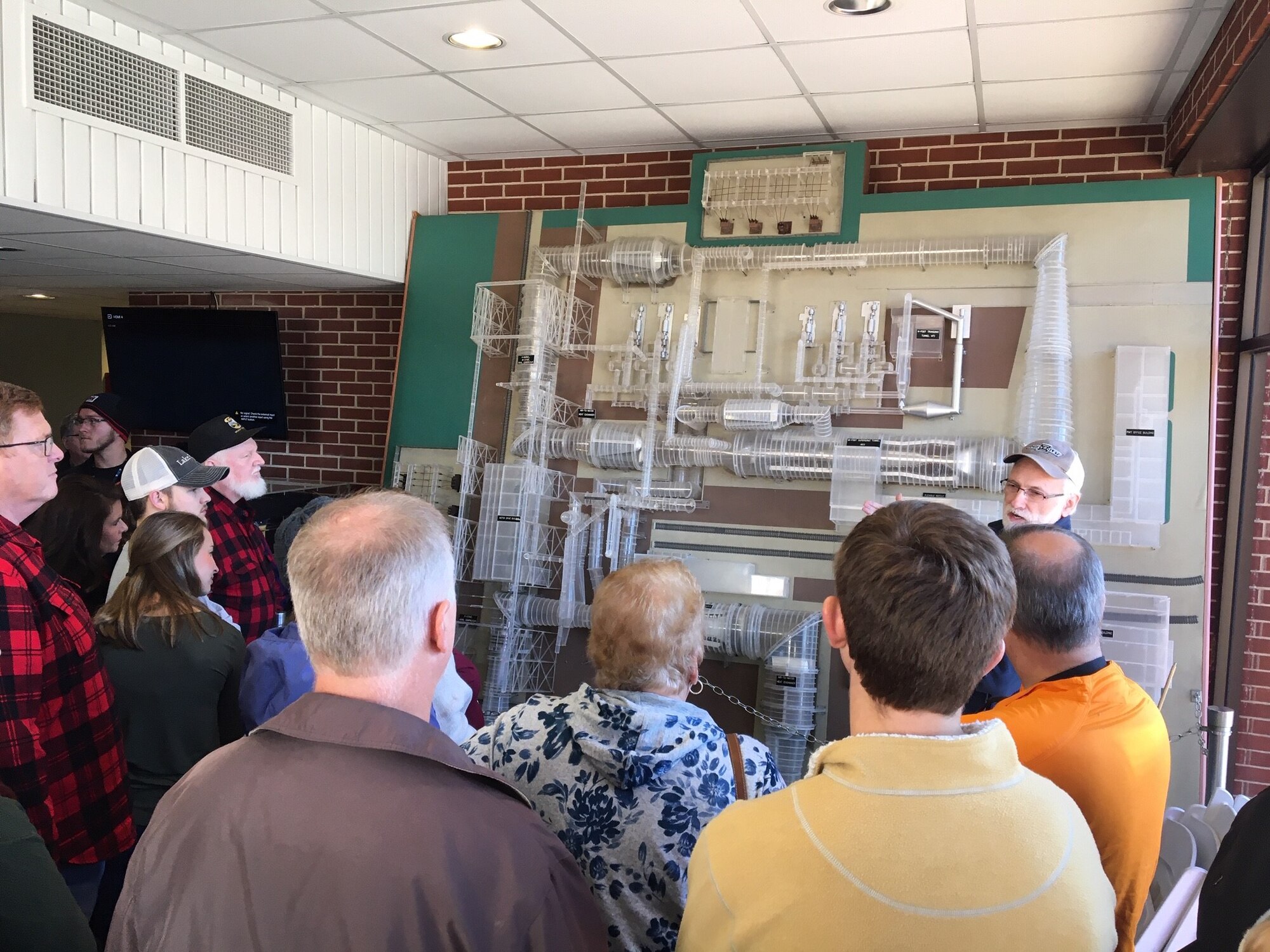 Mike Mills, Arnold Engineering Development Complex Fellow and wind tunnel subject matter expert, speaks to the friends and family of Propulsion Wind Tunnel team members at Arnold Air Force Base Nov. 2 during the Flight Combined Test Force Open House. Mills provided information on how the PWT facility operates and answered several questions. (U.S. Air Force photo)