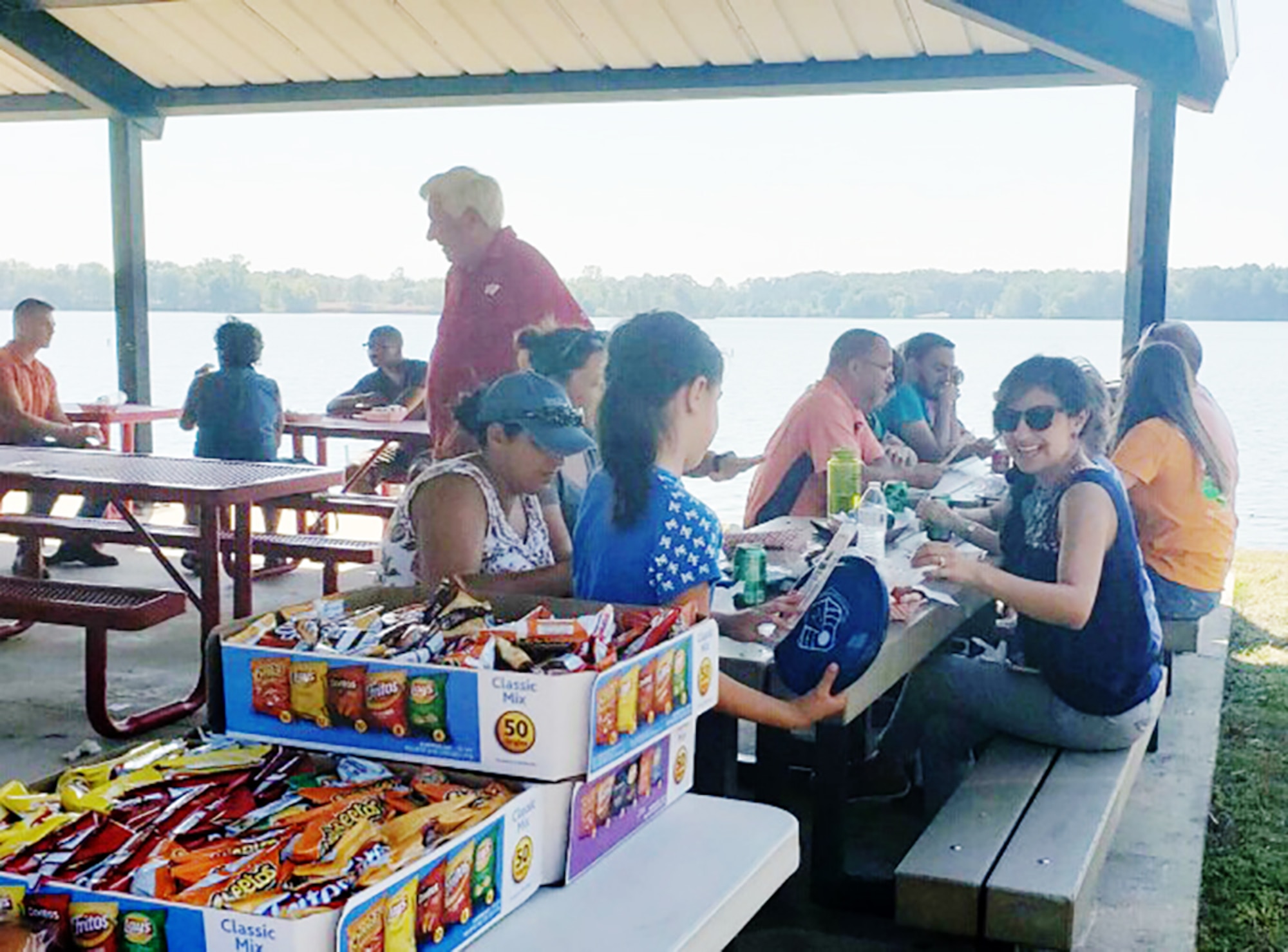 Aeropropulsion Combined Test Force team members and their families socialize during a cookout Oct. 5 at Arnold Lakeside Center as part of a Family Day. The Family Day event provided an opportunity for everyone to get to know one another and gave families some insight about the work being done at Arnold Air Force Base. In addition to lunch at the ALC, Aeropropulsion CTF team members and their families received a tour of some of the facilities on base. (Courtesy photo)