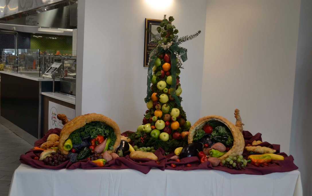 Fresh produce provided by the DLA Troop Support Subsistence supply chain served as a centerpiece on an entryway table Nov. 28, 2019, at the Halverson Hall Dining Facility, Joint Base McGuire-Dix-Lakehurst, New Jersey. The staff of the Halverson Hall Dining Facility provided the traditional Thanksgiving meal for airmen and their families who were away from home for the holiday. (Photo by Alexandria Brimage-Gray)