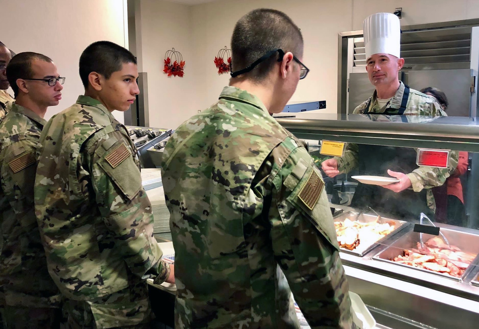 Chief Master Sgt. Stefan Blazier, 37th Training Wing command chief, works the chow line at Thanksgiving dinner for Airmen in basic training at Joint Base San Antonio-Lackland Nov. 28.