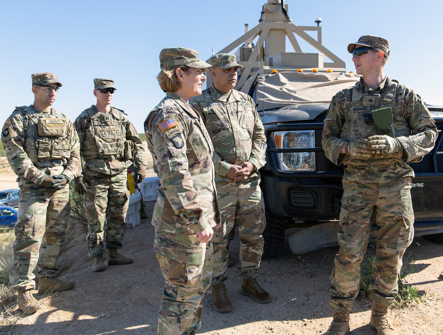 Sgt. Alexander Herakovich, an infantry team leader assigned to Bravo Company, 2nd Infantry Battalion, 4th Infantry Regiment, 3rd Brigade Combat Team, 10th Mountain Division, briefs Lt. Gen. Laura J. Richardson, Commanding General, U.S. Army North, and Command Sgt. Major Alberto Delgado, ARNORTH Senior Enlisted Advisor, on his roles and responsibilities at a mobile surveillance camera site near Tucson, Arizona, during their visit to service members serving along the U.S. southern border Nov. 26.