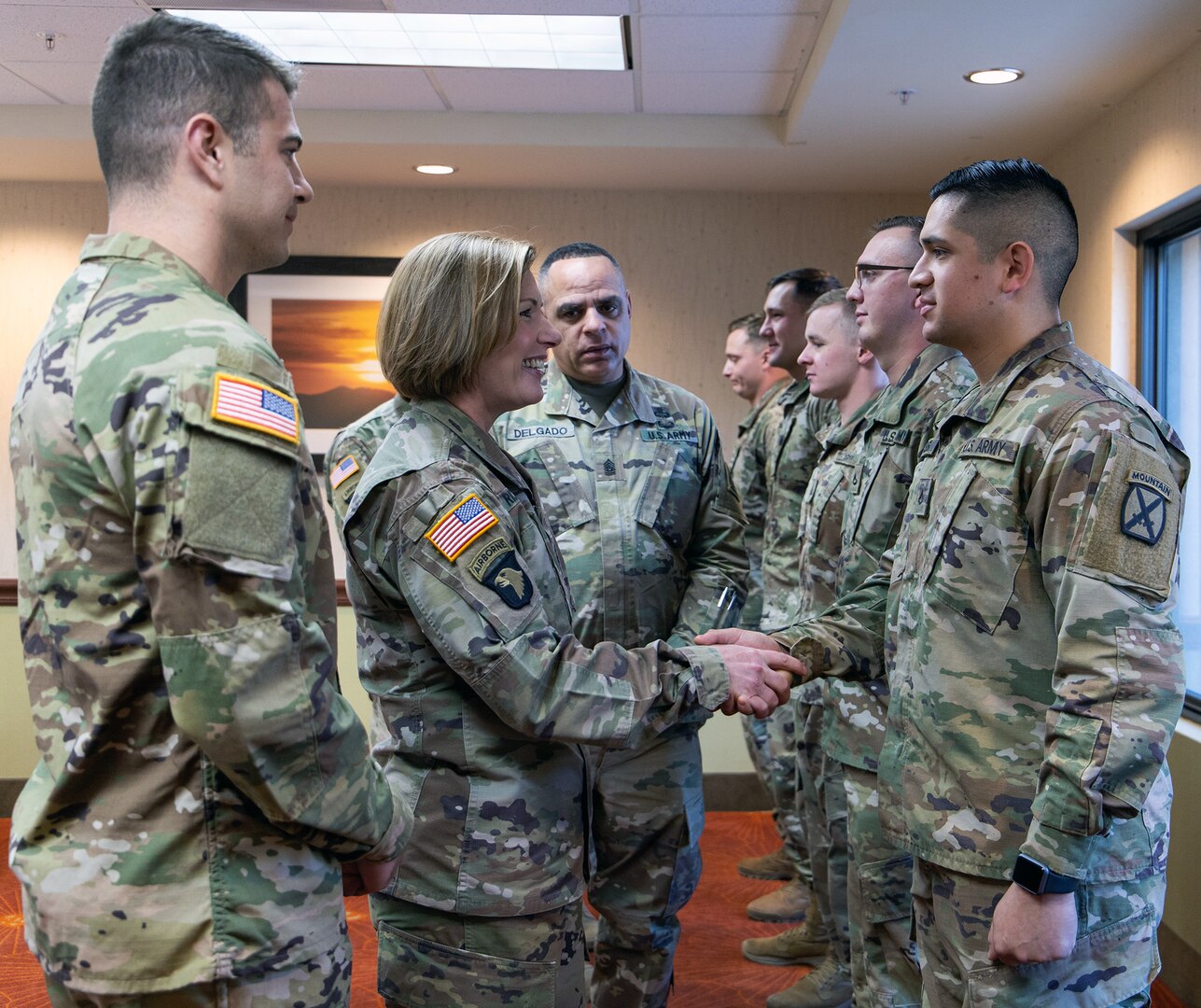 Lt. Gen. Laura J. Richardson, Commanding General, U.S. Army North, and Command Sgt. Major Alberto Delgado, ARNORTH Senior Enlisted Advisor, recognize a group of Soldiers assigned to Bravo Company, 2nd Infantry Battalion, 4th Infantry Regiment, 3rd Brigade Combat Team, 10th Mountain Division for their hard work during their visit to service members working along the U.S. southern border in Tucson, Arizona Nov. 26.