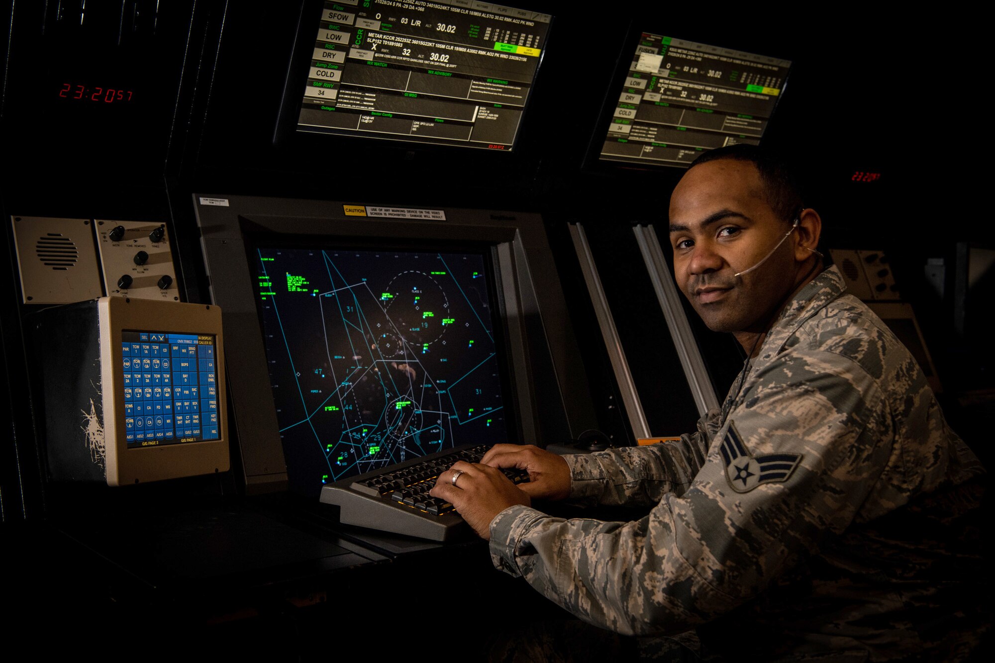 U.S. Air Force Senior Airman James Martin Jr., 60th Operational Support Squadron air traffic control journeyman poses for a portrait in the instrument flight rule room Nov. 25, 2019, at Travis Air Force Base, California. The Warrior of the Week program recognizes outstanding Airmen who have made significant contributions to their unit.  (U.S. Air Force Photo by Nicholas Pilch)