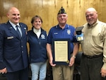 New York Air National Guard Capt. Jason Cole (left), a member of the 224th Air Defense Group, worked with his father, Gary Cole (far right), to replace a Medal of Honor originally issued to the family of his great uncle in World War I. The medal was presented to the Berea Ohio American Legion Post Nov. 18, 2019. Also taking part were Marianna Peris, president of Berea, Ohio American Legion Post 91 Auxiliary, and Mel Baher, past commander of Post 91.