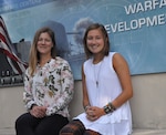 DAHLGREN, Va. (July 12, 2019) – U.S. Naval Academy Midshipman Natalie LaPlaca, right, and her mentor, Laura Maple, a Naval Surface Warfare Center Dahlgren Division (NSWCDD) engineer, are pictured at NSWCDD headquarters during LaPlaca’s summer internship. LaPlaca’s work as an intern on human sensors – titled ‘Correlating Sleep and Temperature Patterns in Navy Warfighters with Current and Future Health Status’ – is her U.S. Naval Academy senior capstone project. (U.S. Navy photo/Released)