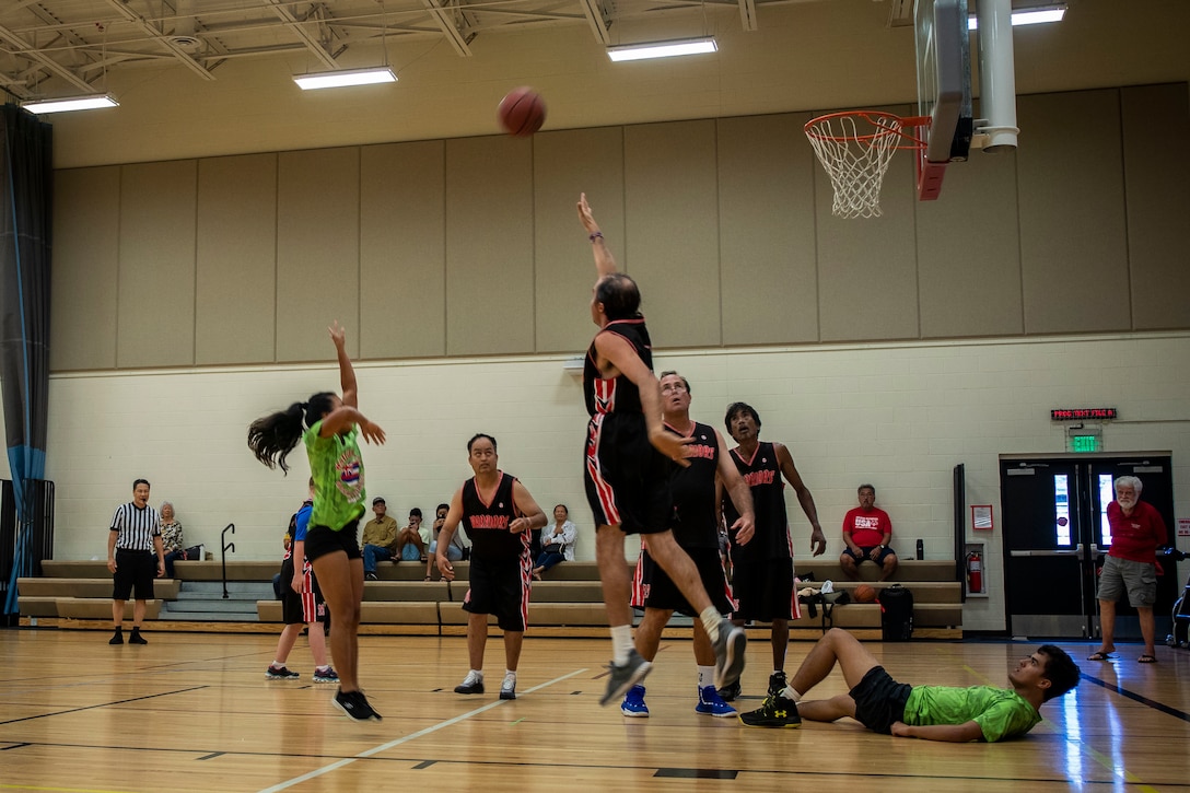 Participants compete in a basketball game during the Special Olympics Hawaii Holiday Classic State Games on Marine Corps Base Hawaii Nov. 23.