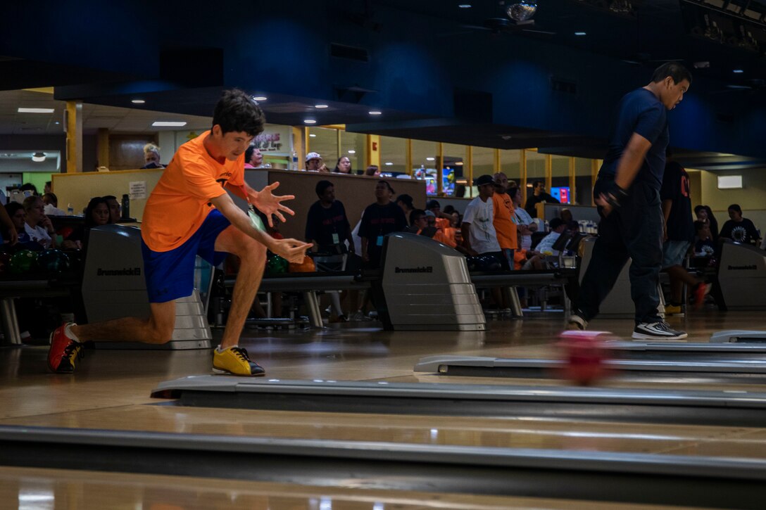 A participant rolls a bowling ball during the Special Olympics Hawaii Holiday Classic State Games on Marine Corps Base Hawaii Nov. 23.