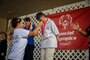 Volunteers present medals to participants during the Special Olympics Hawaii Holiday Classic State Games, Marine Corps Base Hawaii, Nov. 23.