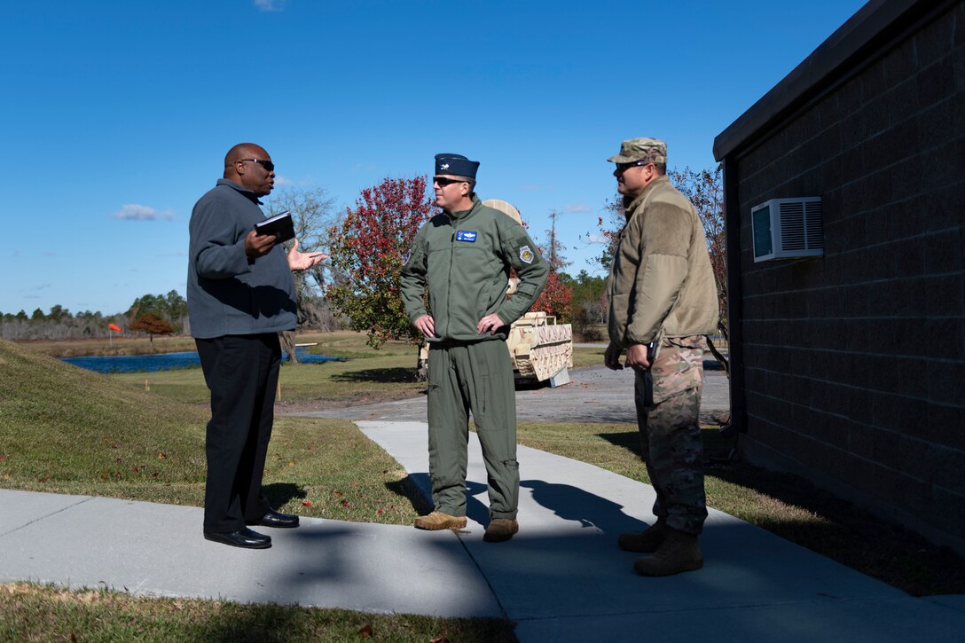 A photo of Perry Tillman speaking with 23d Wing leadership during a 23d OSS immersion