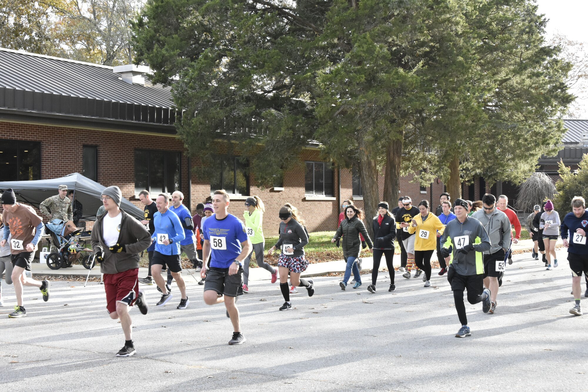 Runners depart the starting line during the 34th annual AEDC Turkey Trot, Nov. 15 at the Arnold Lakeside Center, Arnold Air Force Base. More than three dozen runners and walkers attended the event. (U.S. Air Force photo by Bradley Hicks)