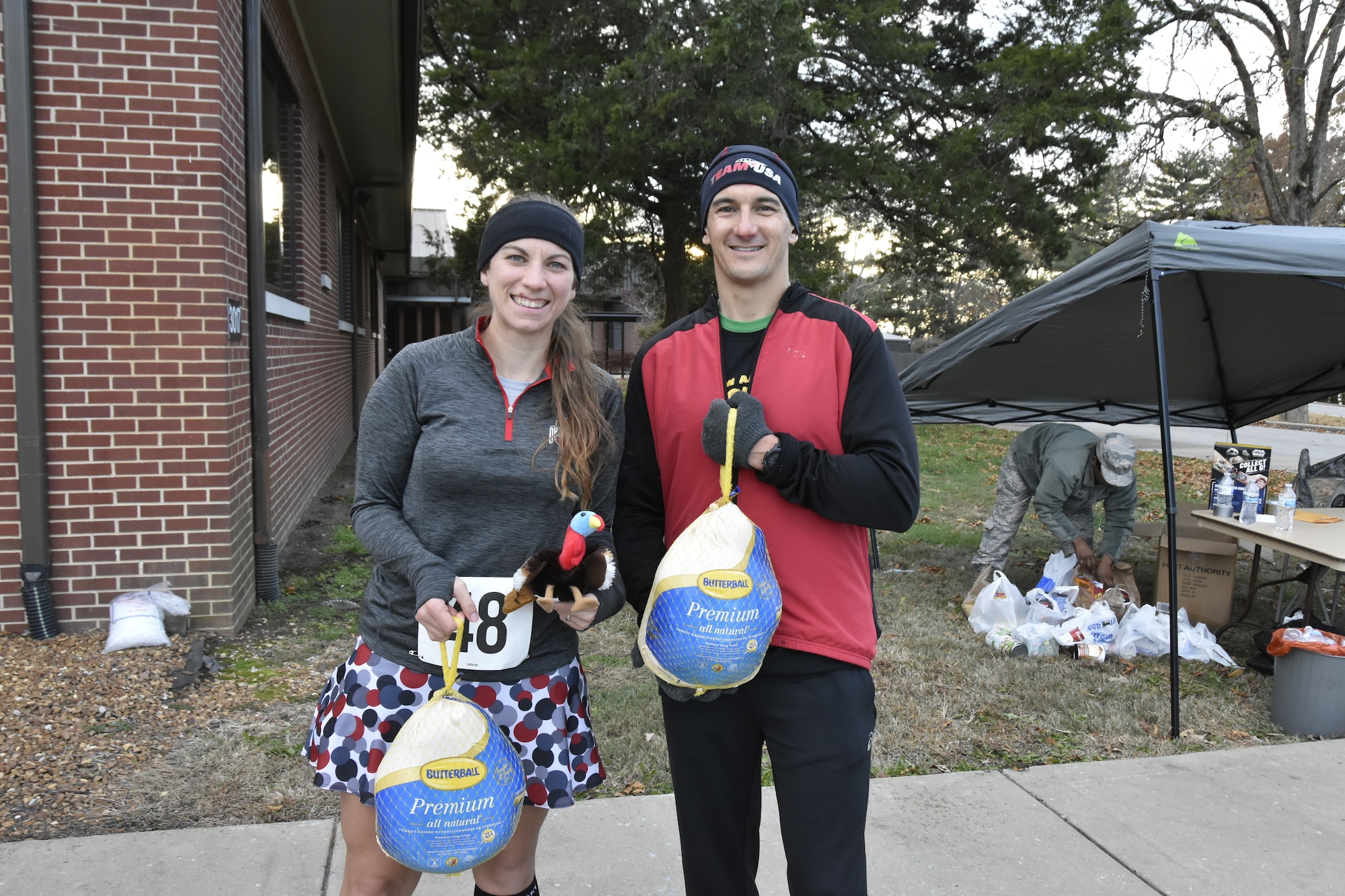 Capt. Elizabeth Sewell and AEDC Commander Col. Jeffery Geraghty show off the turkeys they took home for being the first in their respective divisions to cross the finish line at the 34th Annual AEDC Turkey Trot. The 5K and was held Nov. 15 at the Arnold Lakeside Center, Arnold Air Force Base. Sewell was the first female runner to complete the race with a time of 22 minutes 24 seconds, and Geraghty finished first among male runners with a time of 17 minutes 33 seconds. (U.S. Air Force photo by Bradley Hicks)