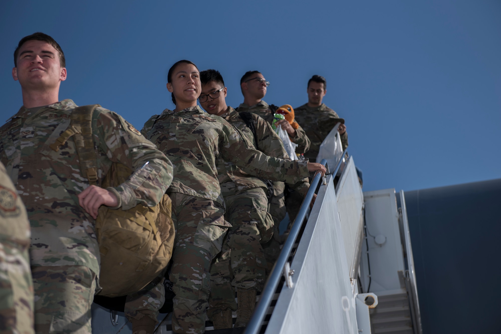 U.S. Air Force Airmen depart a KC-10 Extender Nov. 21, 2019, at Travis Air Force Base, California. The KC-10 returned to Travis AFB for the holidays after supporting operations in Southwest Asia for two months. (U.S. Air Force photo by Airman 1st Class Cameron Otte)