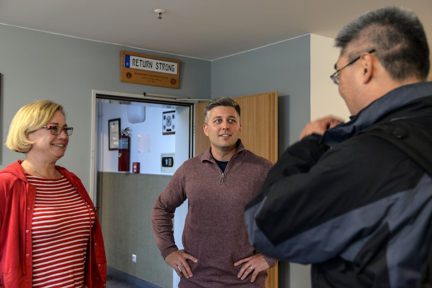 A photo of individuals from the 48th RQS discussing their Airmen.