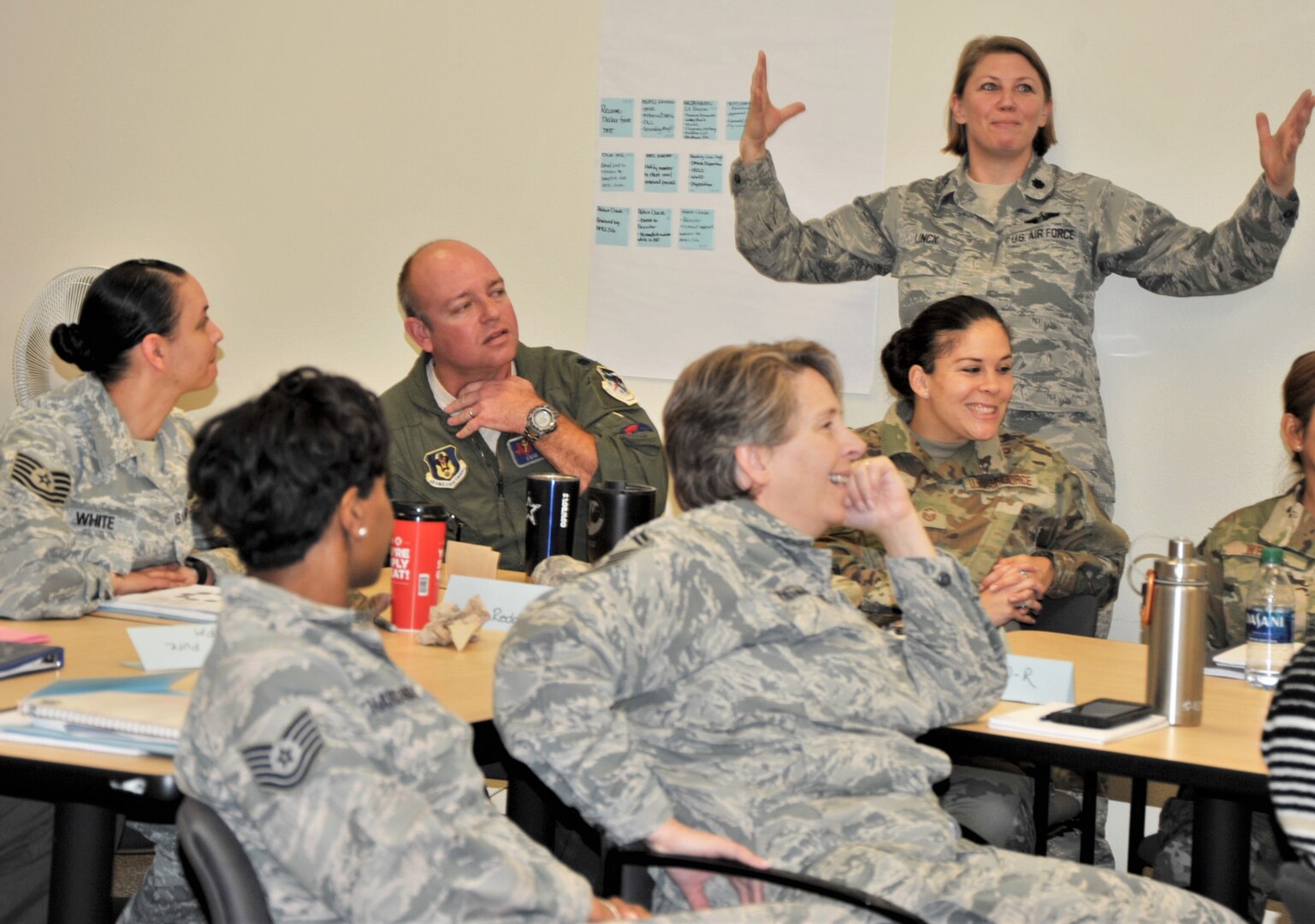 Lt. Col. Sara Linck, 340th Flying Training Group continuous improvement manager, emphasizes a point to group members during the Nov. 19-21 CPI event at Joint Base San Antonio-Randolph, Texas, to address pay issues that occur when Reserve members transition between pay statuses. Other members pictured are (back row left to right) Tech. Sgt. Janina White, Lt. Col. and Lt. Col. Thad Reddick, and Master Sgt. Valerie Valdes, (front row left to right) Tech. Sgt. Ecstacy Hardaway and Senior Master Sgt. Amy Whitman-Rector. (U.S. Air Force photo by Debbie Gildea)