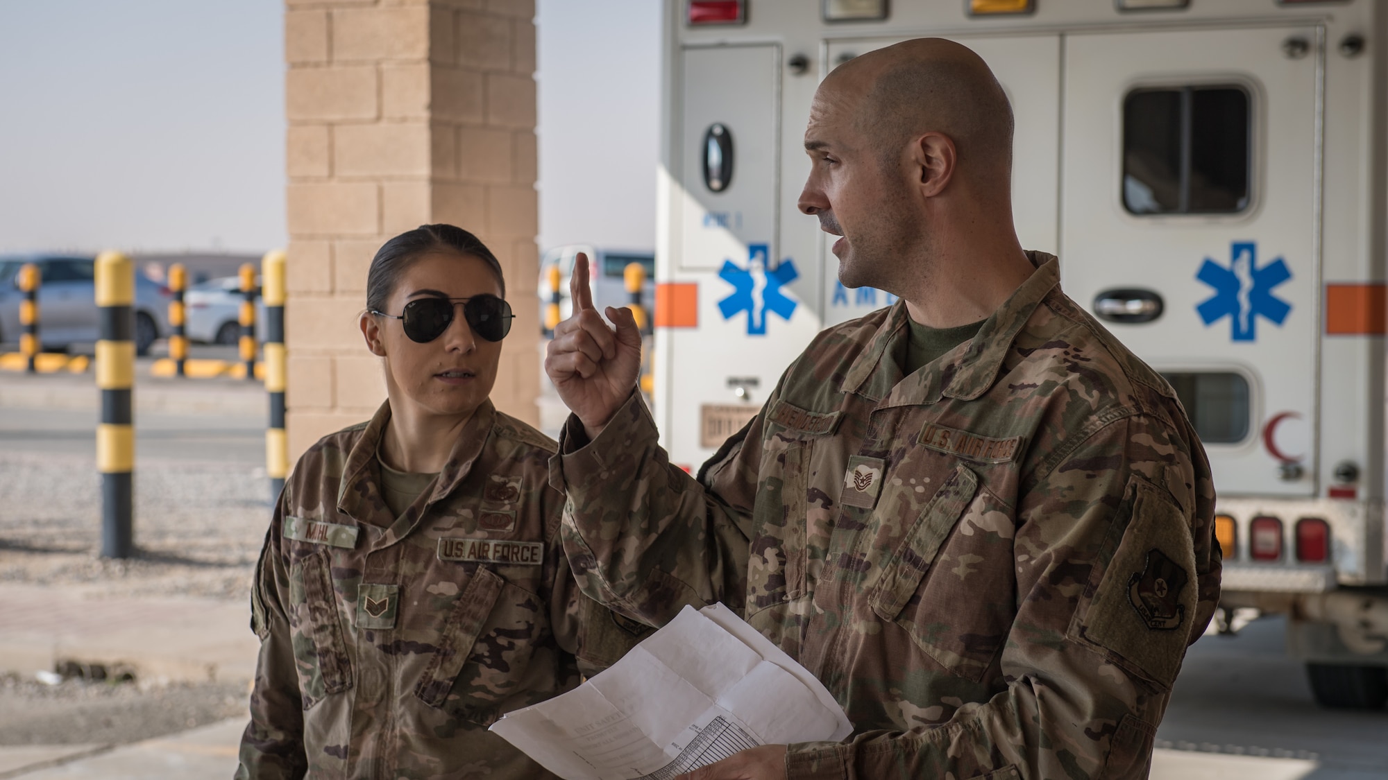 U.S. Air Force Staff Sgt. Courtney Muhl, 386th Air Expeditionary Wing occupational safety NCO-in-charge, performs a safety inspection in the ambulance bay outside the base clinic with Tech. Sgt. Joshua Henderson, 386th Expeditionary Medical Group biomedical engineering technician and medical facility manager, at Ali Al Salem Air Base, Kuwait, Nov. 27, 2019. Muhl conducted an annual safety inspection of the clinic ensuring it complied with safety requirements, standards and programs. (U.S. Air Force photo by Tech. Sgt. Daniel Martinez)