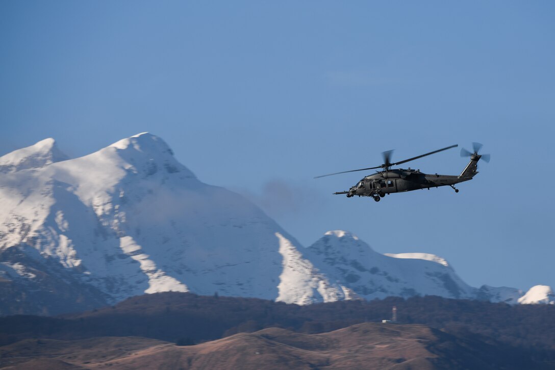 An HH-60G Pave Hawk helicopter operated by the 56th Rescue Squadron flies across the Italian Dolomites at Aviano Air Base, Italy, Dec. 3, 2019. All HH-60Gs have an automatic flight control system, night vision goggles with lighting and a forward looking infrared system that greatly enhance night low-level operations. (U.S. Air Force photo by Airman 1st Class Ericka A. Woolever).