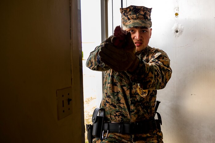 U.S. Marines Corps Lance Cpl. William Anderson with Headquarters and Support Battalion, Provost Marshal Office, Operations, participates in an active shooter, training Camp Foster, Okinawa, Japan, Nov. 26, 2019. Marines with PMO conducted the training to ensure readiness and reliability in the event of an active shooter.