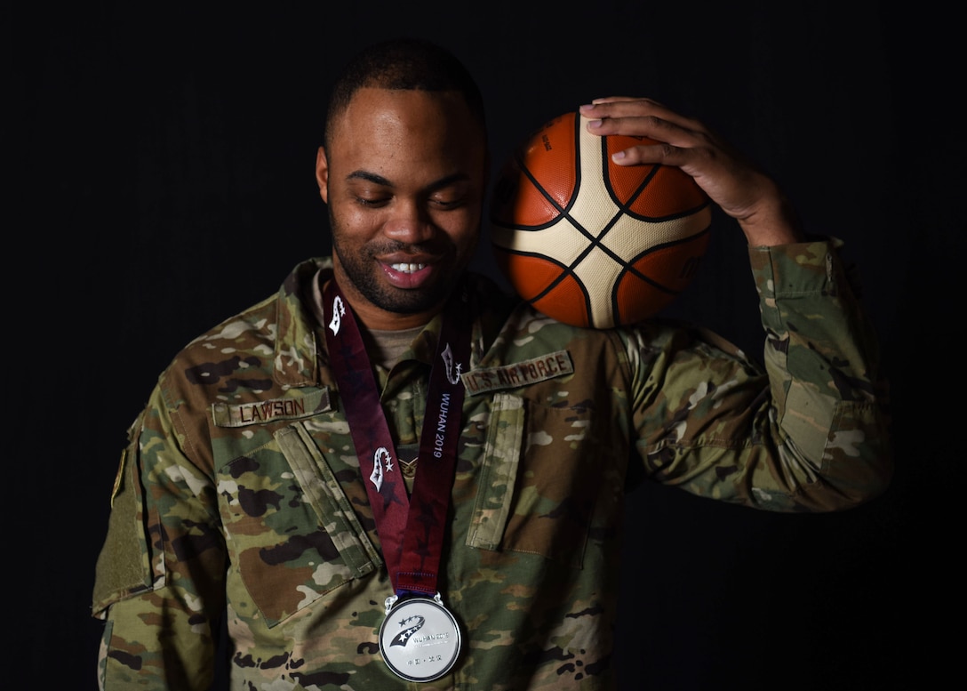 Staff Sgt. Jahmal Lawson, 30th Security Forces Squadron mobility equipment custodian, displays the silver medal he won at the 2019 Military World Games, Nov. 27, 2019 at Vandenberg Air Force Base, Calif. Lawson played on the U.S. basketball team during the Military World Games, which were held Oct. 18–27, 2019 in Wuhan, China. (U.S. Air Force photo by Airman 1st Class Aubree Milks)
