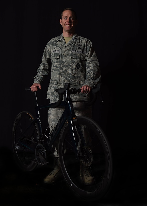 Lt. Col. Ian Holt, 614th Air Operation Center current ops branch chief, poses with his bicycle Nov. 27, 2019 at Vandenberg Air Force Base, Calif. Holt participated in the cycling division during the 2019 Military World Games, which were held Oct. 18–27, 2019 in Wuhan, China. (U.S. Air Force photo by Airman 1st Class Aubree Milks)