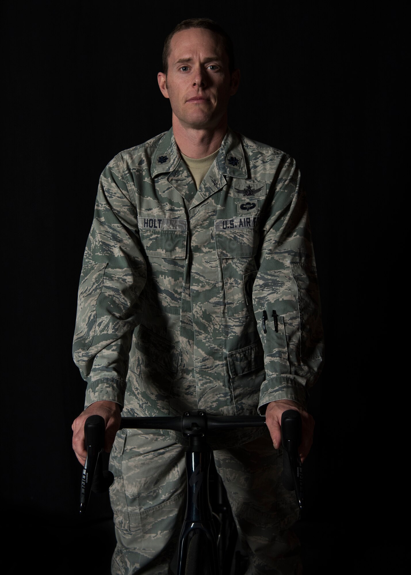 Lt. Col. Ian Holt, 614th Air Operation Center current ops branch chief, poses with his bicycle Nov. 27, 2019 at Vandenberg Air Force Base, Calif. Holt participated in the cycling division during the 2019 Military World Games, which were held Oct. 18–27, 2019 in Wuhan, China. (U.S. Air Force photo by Airman 1st Class Aubree Milks)
