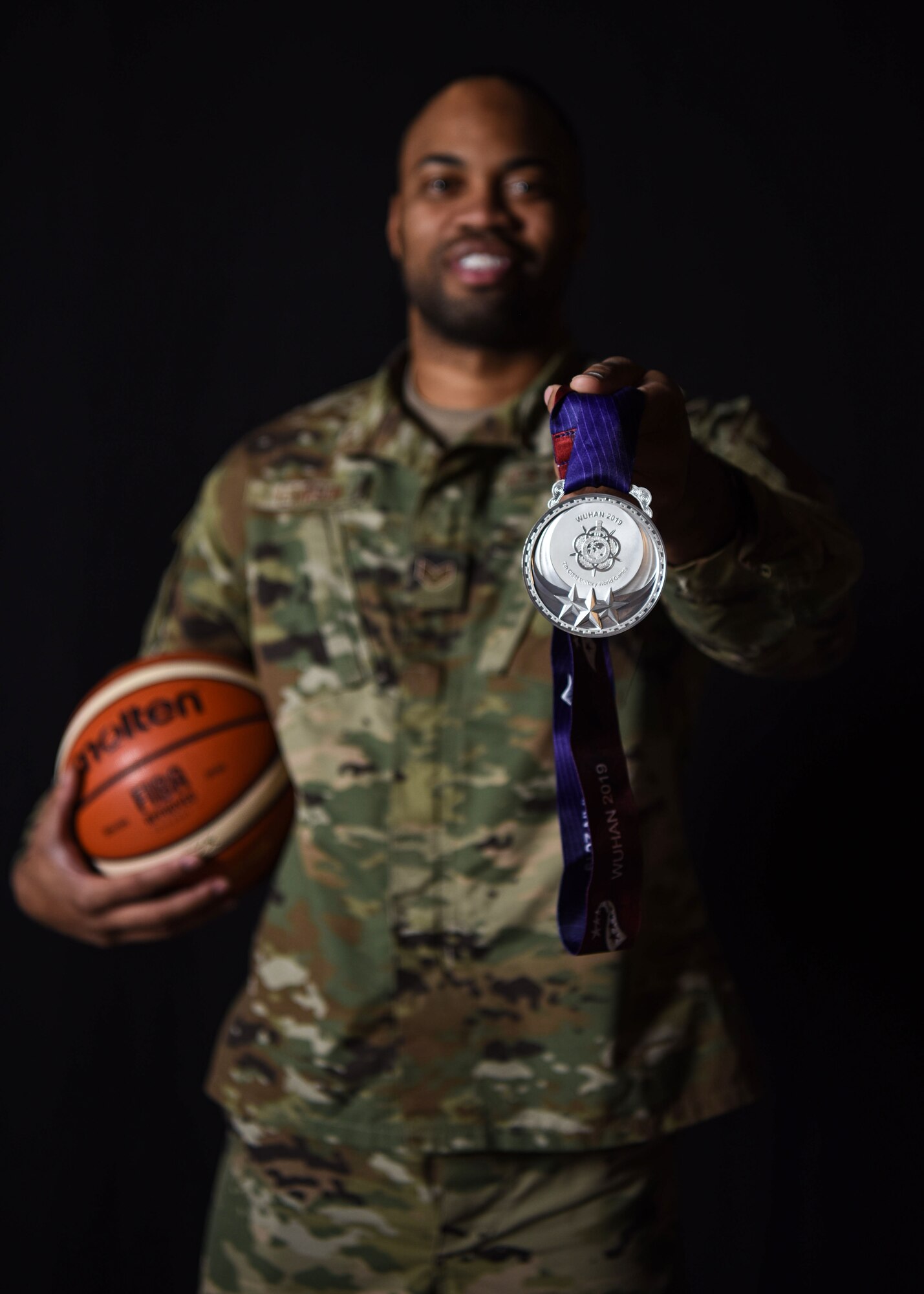 Staff Sgt. Jahmal Lawson, 30th Security Forces Squadron mobility equipment custodian, displays the silver medal he won at the 2019 Military World Games, Nov. 27, 2019 at Vandenberg Air Force Base, Calif. Lawson played on the U.S. basketball team during the Military World Games, which were held Oct. 18–27, 2019 in Wuhan, China. (U.S. Air Force photo by Airman 1st Class Aubree Milks)