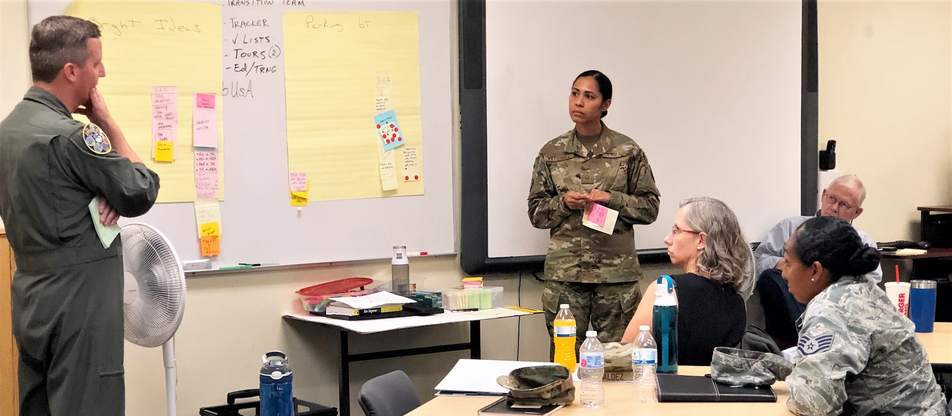 Master Sgt. Tainell Pettengill, 340th Flying Training Group undergraduate flying training section non-commissioned officer in charge, provides the out brief overview to Lt. Col. Brent Drown, 340th FTG deputy commander on counter measures and action plans her group devised to address pay issues that occur when Reserve members transition between pay statuses. Drown stood in for the improvement process champion, 340th FTG Commander Col. Allen Duckworth at the Nov. 19-21 continuous process improvement event at Joint Base San Antonio-Randolph, Texas. (U.S. Air Force photo by Janis El Shabazz)