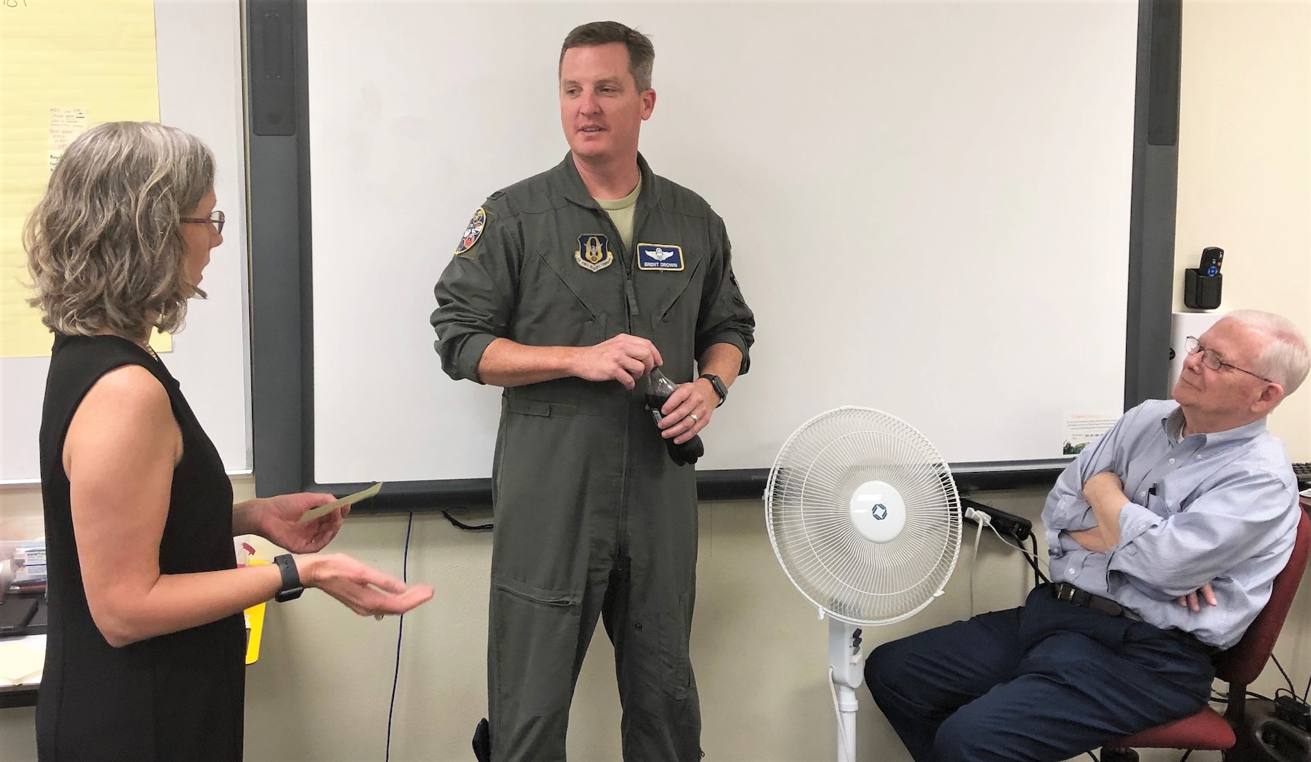 Teresa Davies, 340th Flying Training Group continuous improvement manager, receives feedback from Lt. Col. Brent Drown, 340th FTG deputy commander, on counter measures and action plans her group devised at the Nov. 19-21 continuous process improvement event at Joint Base San Antonio-Randolph, Texas to address pay issues that occur when Reserve members transition between pay statuses. Also pictured is as Bob Daffin, Air Force Reserve Command, Robins Air Force Base, Georgia. Drown stood in for the improvement process champion, 340th FTG Commander Col. Allen Duckworth as Davies’ (U.S. Air Force photo by Janis El Shabazz)