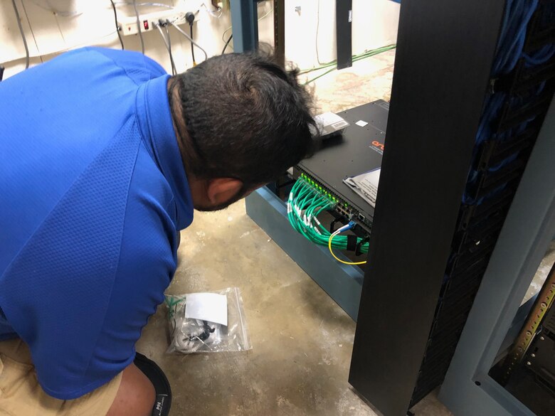 Contractors with the 502nd Communications Squadron install Wi-Fi capability at the 99th Flying Training Squadron at Joint Base San Antonio-Randolph, Texas, Dec. 10, 2018. The Wi-Fi is being installed to offer Airmen in education and training environments a flexible service connectivity option to access or utilize resources such as electronic flight bags, as well as augmented and virtual reality technologies. (U.S. Air Force photo / Dan Hawkins)