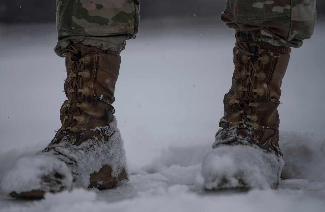 Hercules Airmen de-ice aircraft, re-ice each other