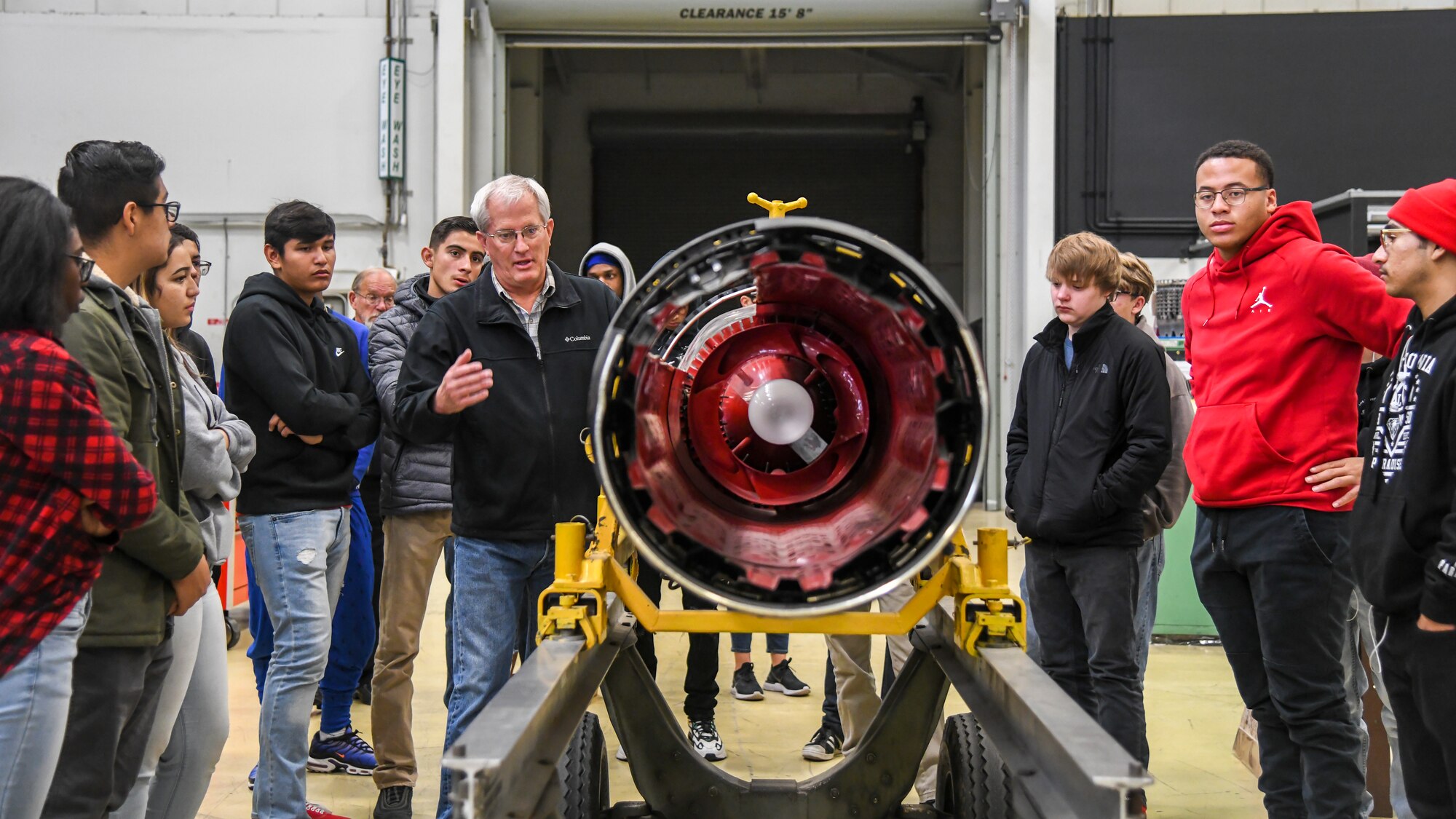 Gregory Peria, Propulsion Production Superintendent, 412th Maintenance Squadron, describes the various components of a jet engine to Victor Valley High School students during their tour of Edwards Air Force Base, California, Dec. 3. The students were members of the high school’s aviation maintenance classes, which include airframe and power plant classes as well as aircraft composite repair and fabrication. (Air Force photo by Giancarlo Casem)