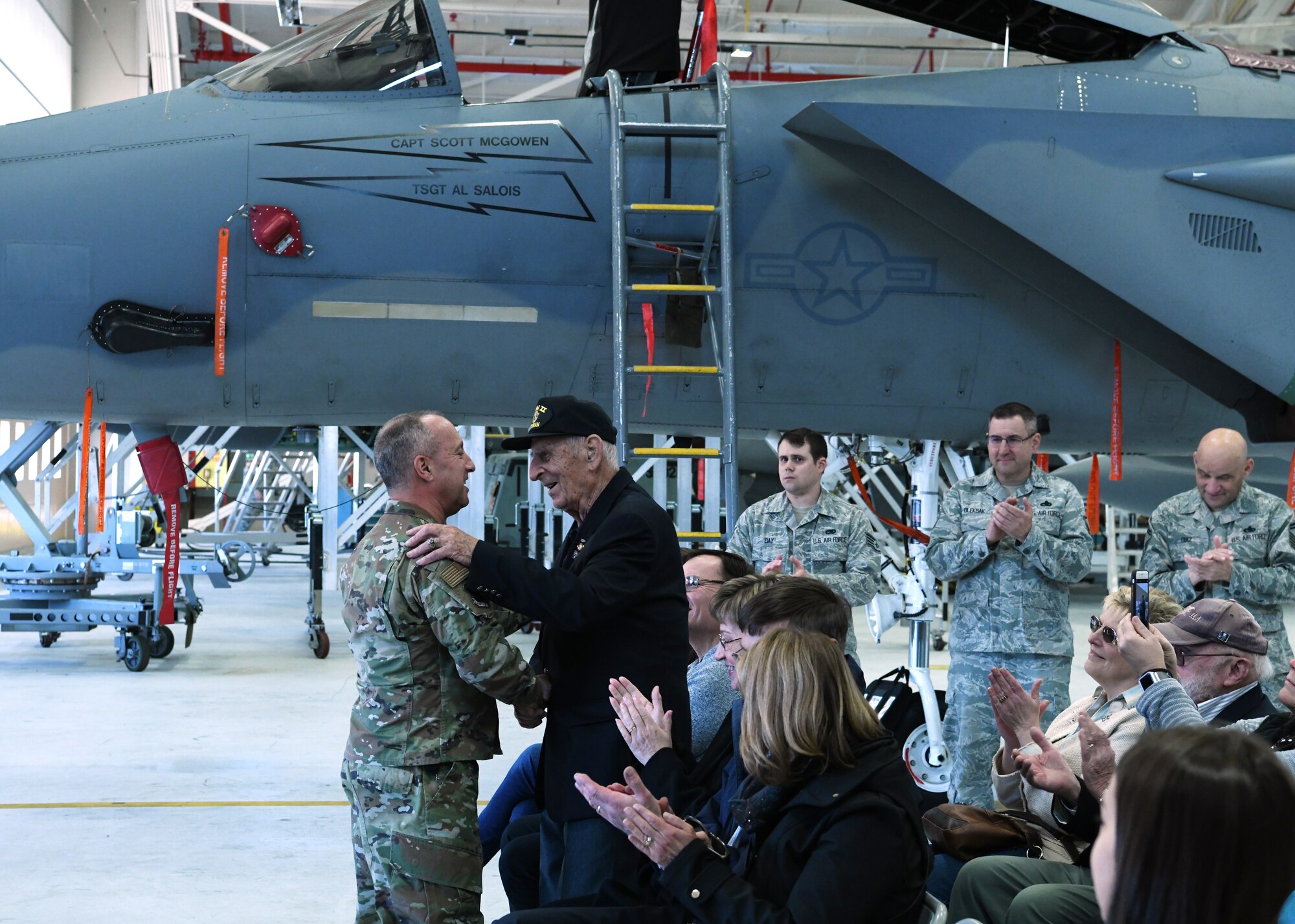 The 104th Fighter Wing threw a suprise birthday for retired Col. Edwin J. Malikowski on November 25, 2019. Malikowski turns 100 years old on November 29, 2019 and spent 39 years in service  through the Army and Air National Guard. 104th Fighter Wing Commander, Col. Pete Green awarded Malikowski with a commanders coin as an appreciation for his accomplishments and dedication. (U.S. Air National Guard Photo by Airman Camille Lienau)