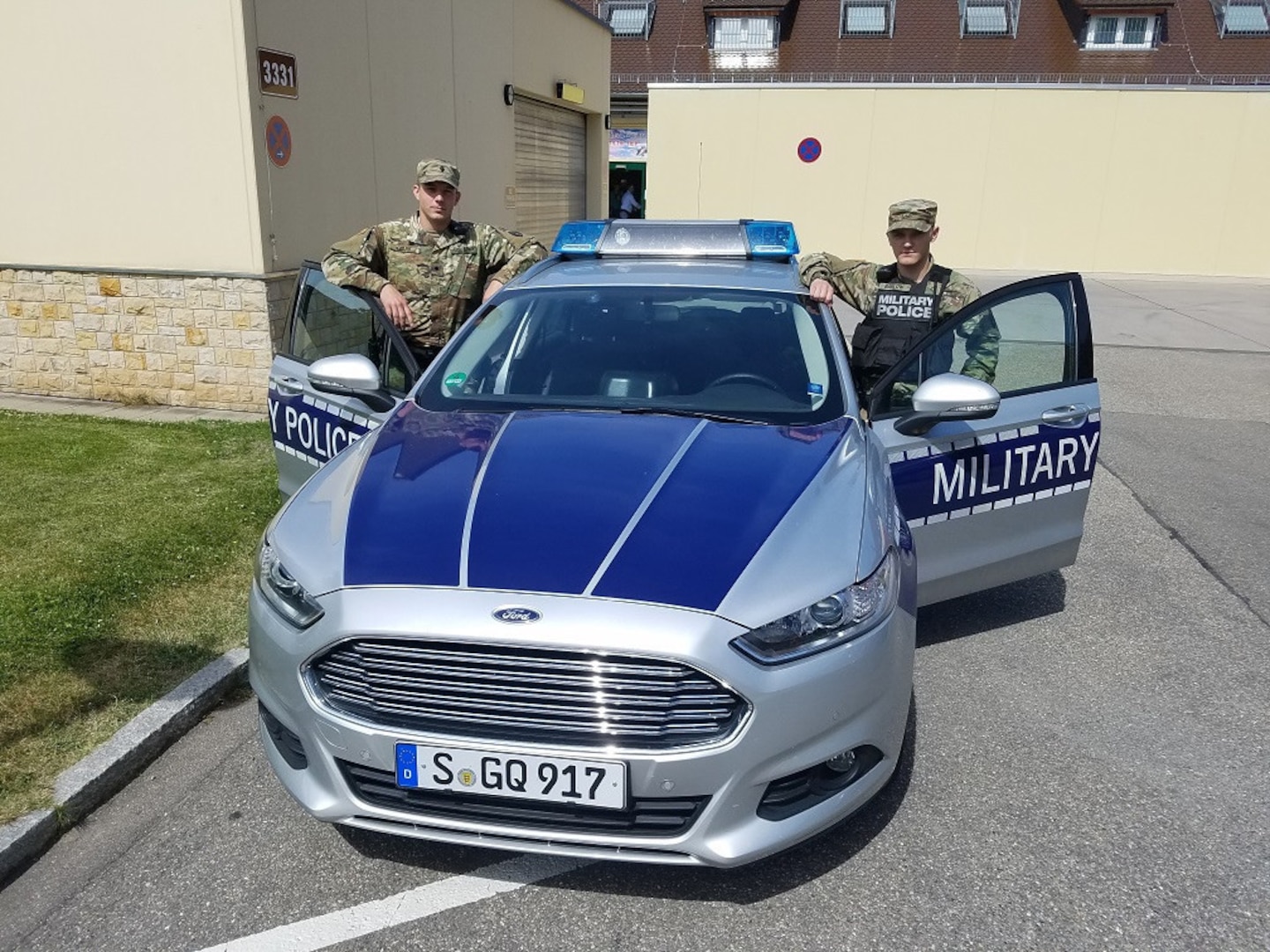 Spc. John Clark with the 1103rd Military Police Detachment - Law & Order works alongside active duty Spc. Barlow patrolling Stuttgart, Germany, June 11, 2017.